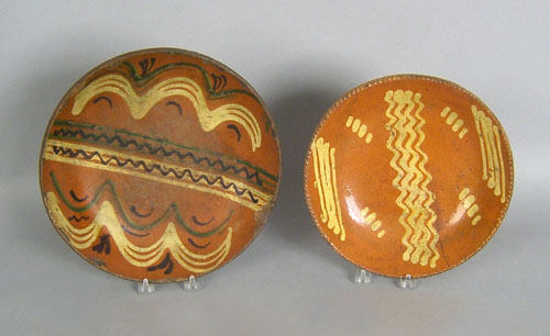 Appraisal: Two redware chargers th c with slip decoration dia and