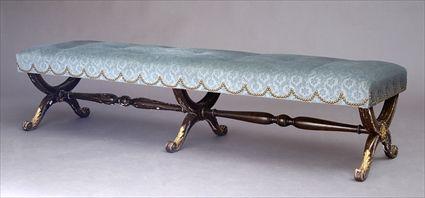 Appraisal: REGENCY ROSEWOOD AND PARCEL-GILT BENCH The velvet upholstered top raised