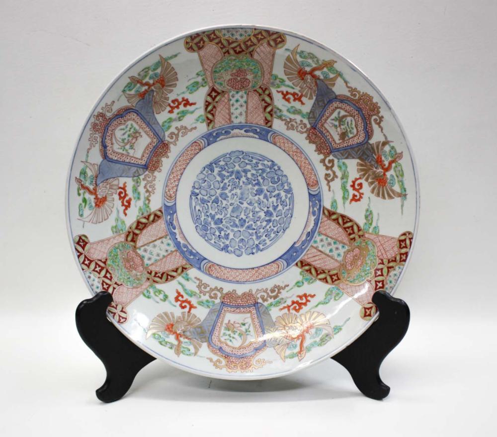 Appraisal: JAPANESE PORCELAIN CHARGER featuring blue and white stylized floral center