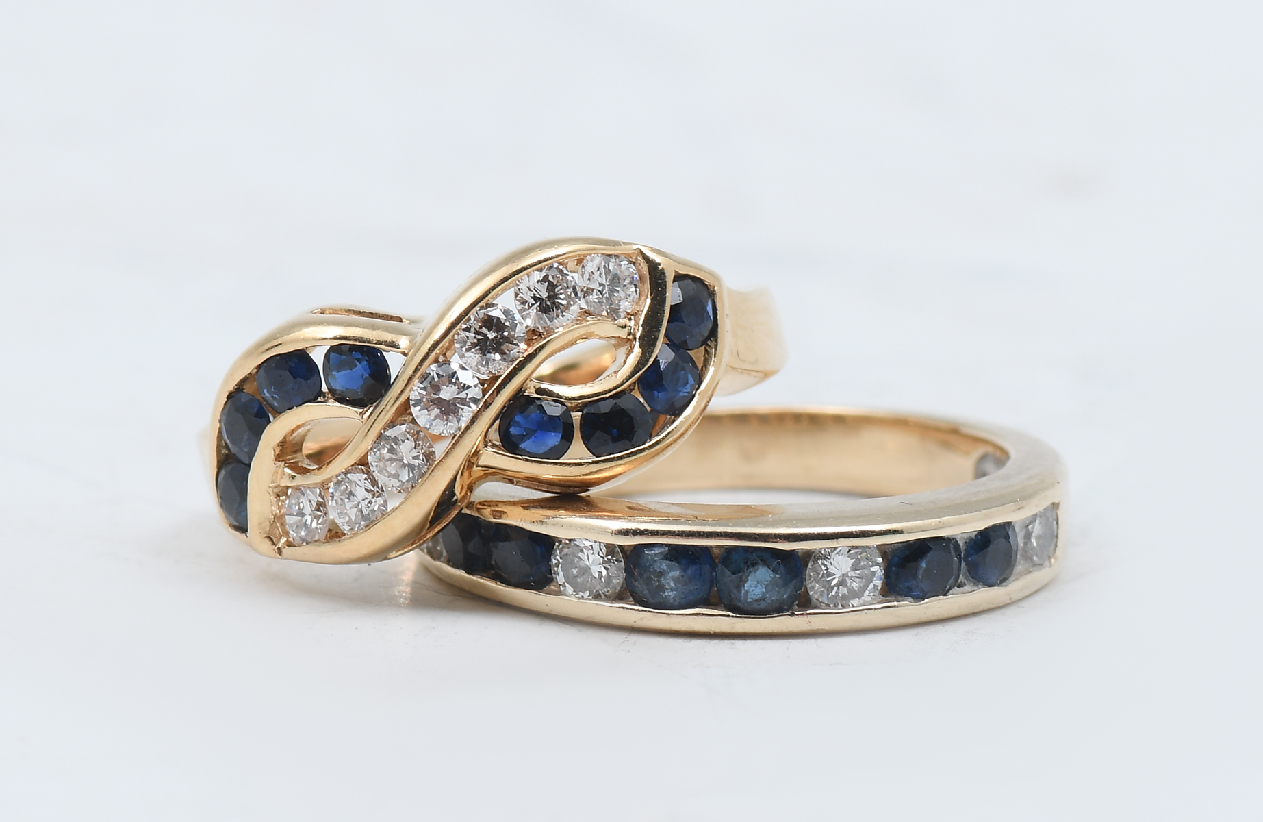 Appraisal: K K SAPPHIRE DIAMOND BAND INFINITY RING K yellow gold