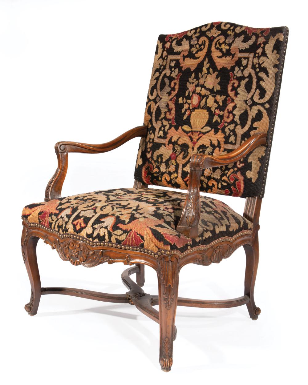 Appraisal: Regence-Style Carved Walnut Fauteuil foliate carved arms needlepoint upholstery with