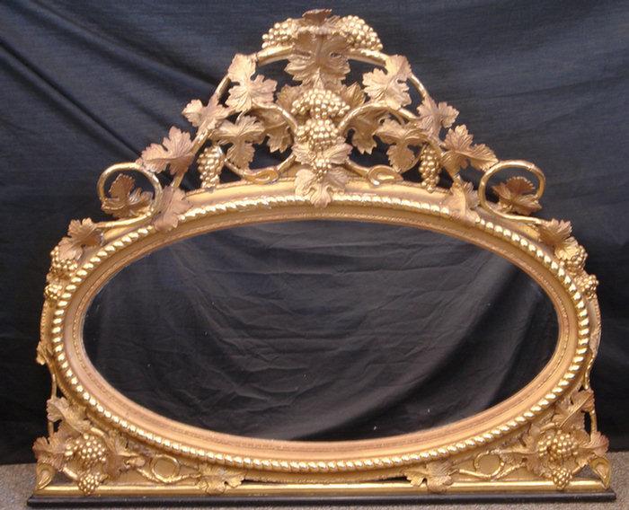 Appraisal: Oval goldleaf Victorian over mantle mirror with gadrooned border grapevine