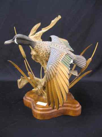 Appraisal: Jim Owens Wood Carving duck in flight '' plus wooden