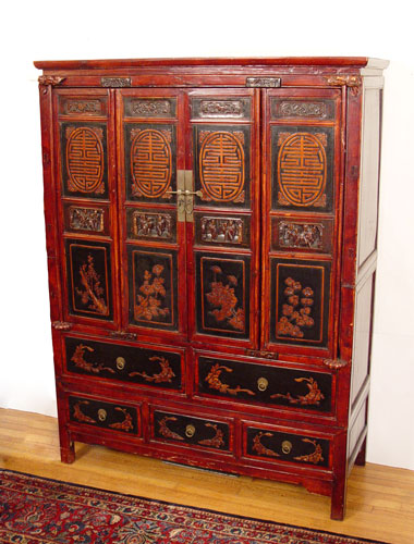 Appraisal: ORNATE CHINESE CABINET Painted and carved folding door cabinet the