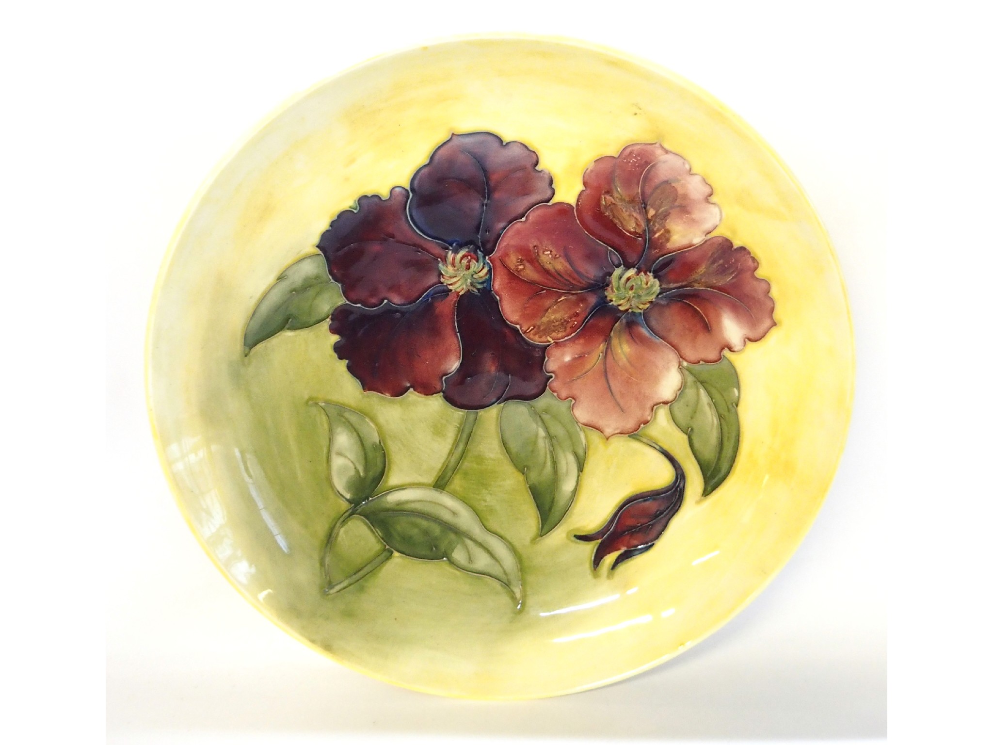 Appraisal: A large Moorcroft Hibiscus decorated dish on yellow ground