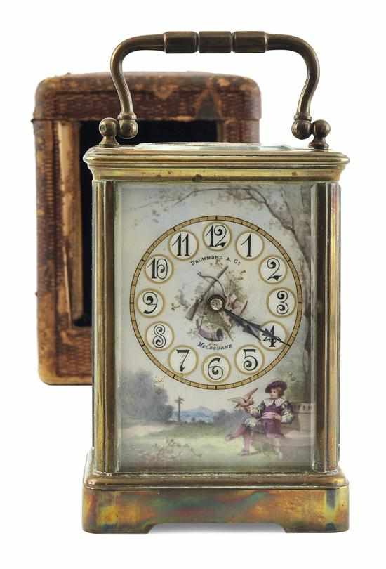 Appraisal: A BRASS AND ENAMEL CARRIAGE CLOCK AND TRAVEL CASE THE