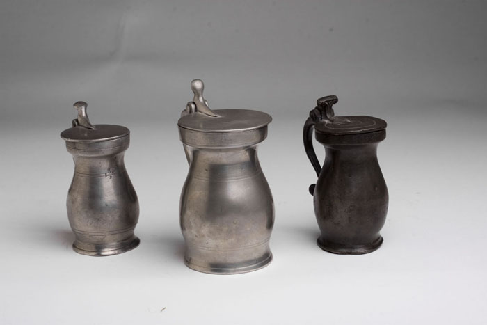 Appraisal: THREE ENGLISH PEWTER LIDDED MEASURES EARLY NINETEENTH CENTURY Each of