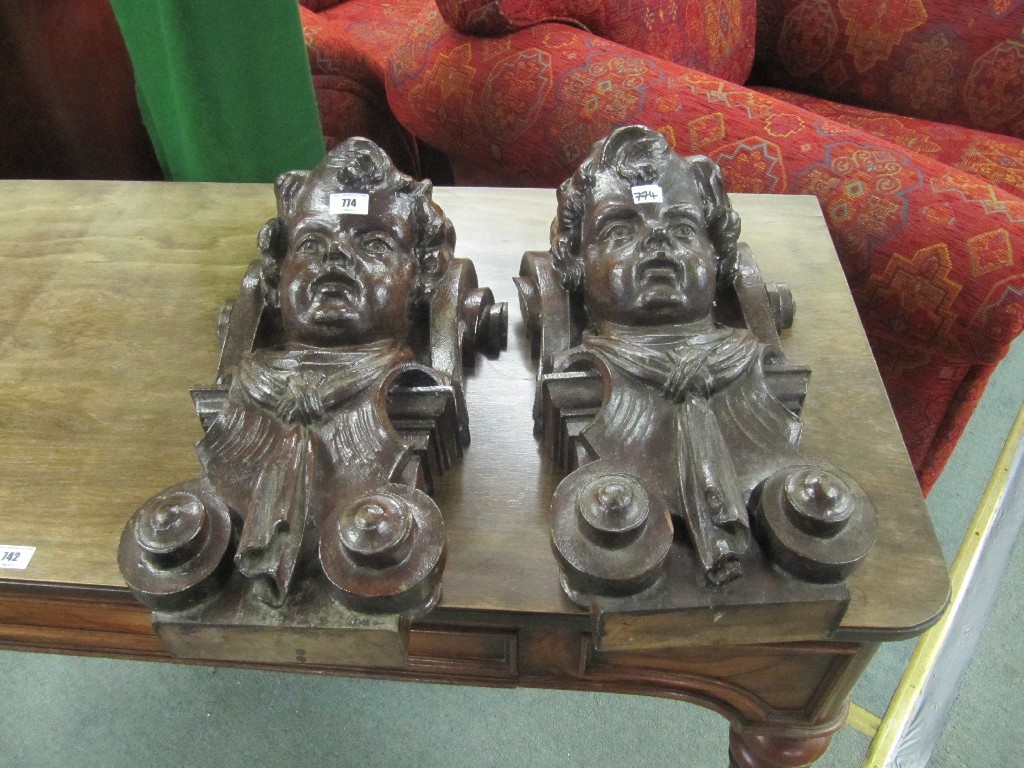 Appraisal: Pair of carved wood figural wall brackets