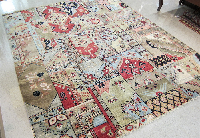 Appraisal: HAND KNOTTED ORIENTAL CARPET random color panel design without borders