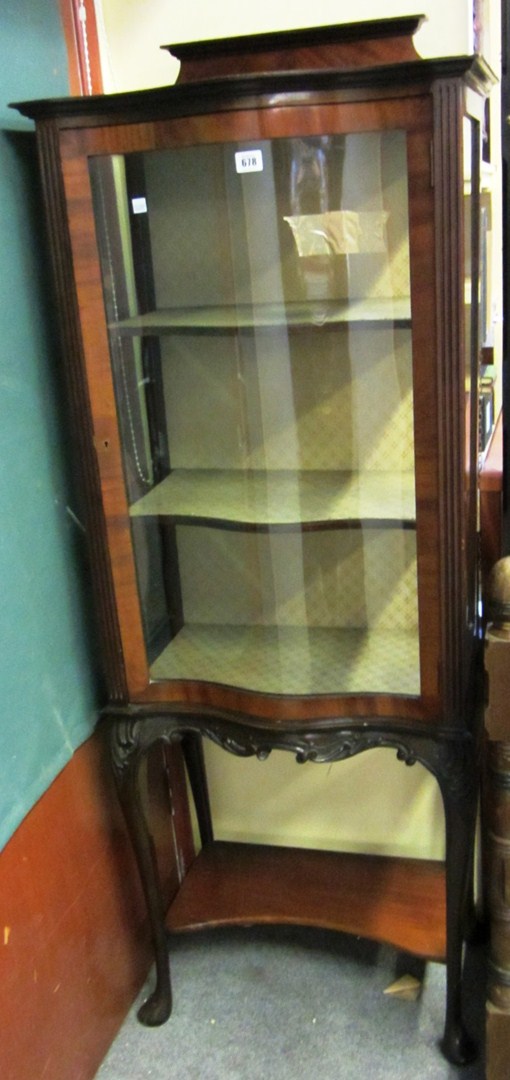 Appraisal: An early th century mahogany display cabinet with single serpentine