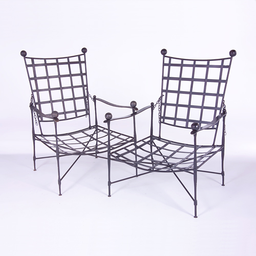 Appraisal: MARIO PAPPERZINI SALTERINI Pair of iron lounge chairs with latticed