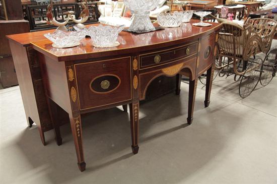 Appraisal: REPRODUCTION SIDEBOARD Bow front mahogany sideboard with faux inlay central