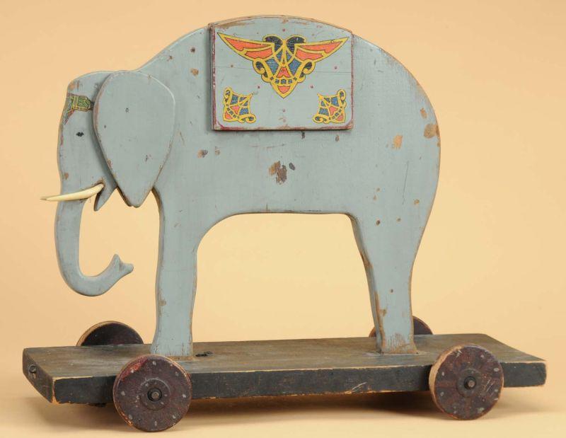 Appraisal: Wooden Folk Art Elephant Pull Toy Painted gray wooden elephant