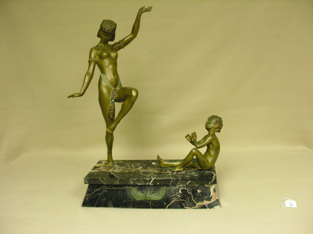 Appraisal: BRONZE FIGURAL GROUPING NUDE DECO DANCER With child playing flute