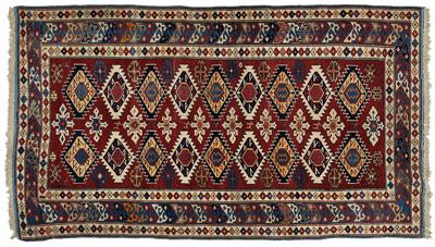 Appraisal: Finely woven Caucasian rug repeating serrated diamonds on dark burgundy