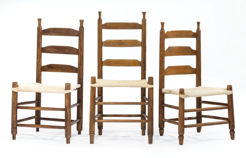 Appraisal: Three Acadian Hardwood Ladderback Side Chairs thc turned finials shaped