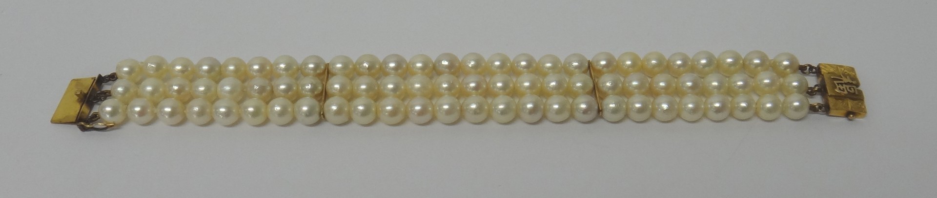 Appraisal: A three row bracelet of cultured pearls on a rectangular