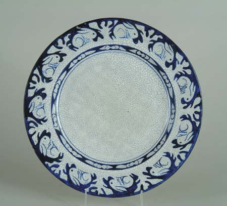 Appraisal: DEDHAM POTTERY CAKE PLATE WITH RABBIT BORDER Deep blue with