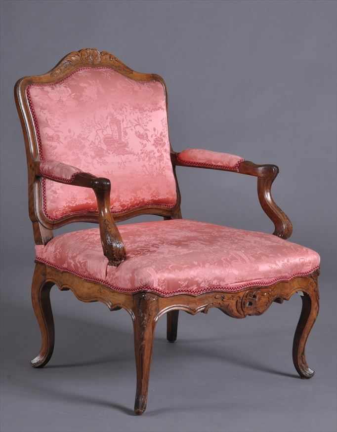 Appraisal: LOUIS XV CARVED WALNUT FAUTEUIL LA REINE The cartouche-shape back