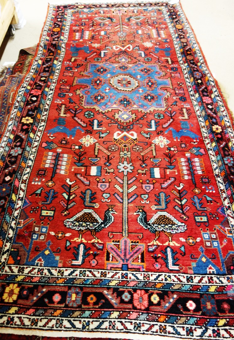 Appraisal: A West Persian rug the madder field with a bold