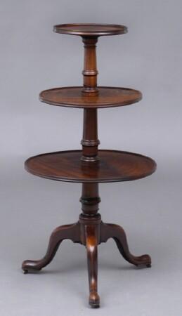 Appraisal: GEORGE III MAHOGANY DUMBWAITER With graduated molded tiers on column