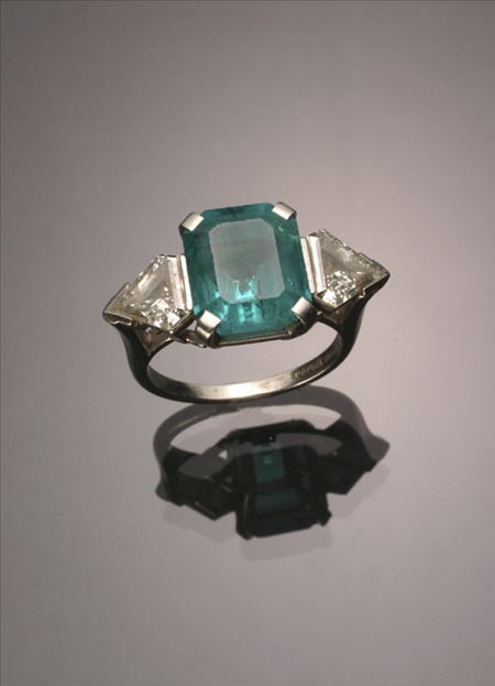 Appraisal: Platinum Emerald and Twin-Diamond Dinner Ring The four-prong A-box mount