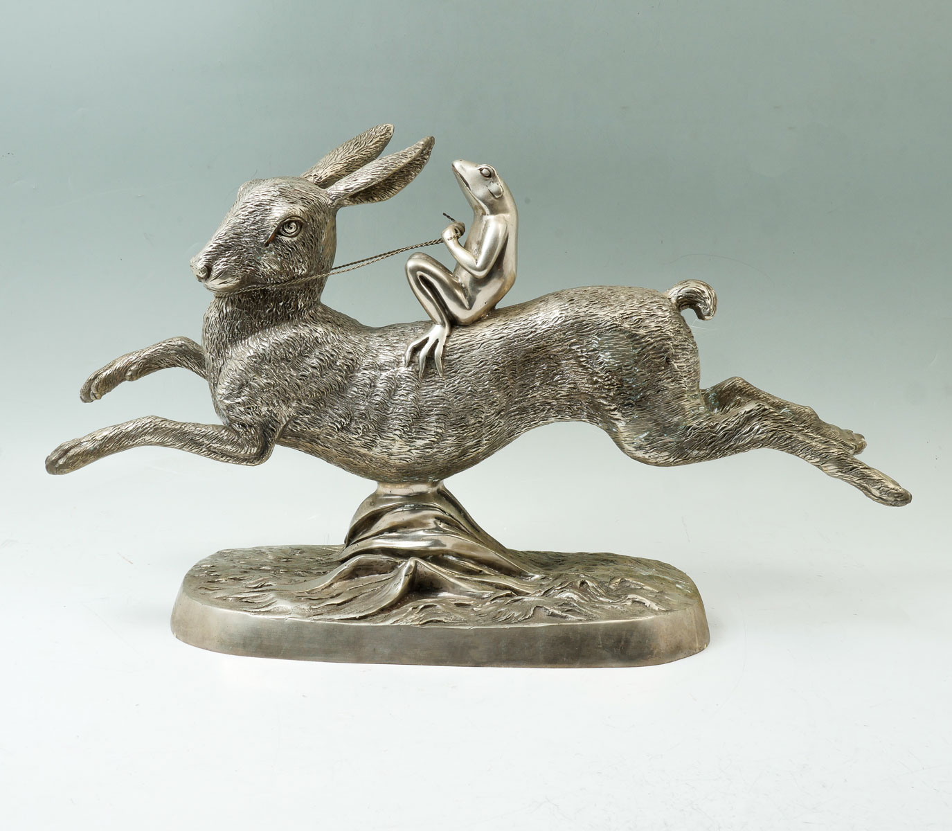 Appraisal: AMUSING SILVERED BRONZE SCULPTURE OF A FROG RIDING A RABBIT