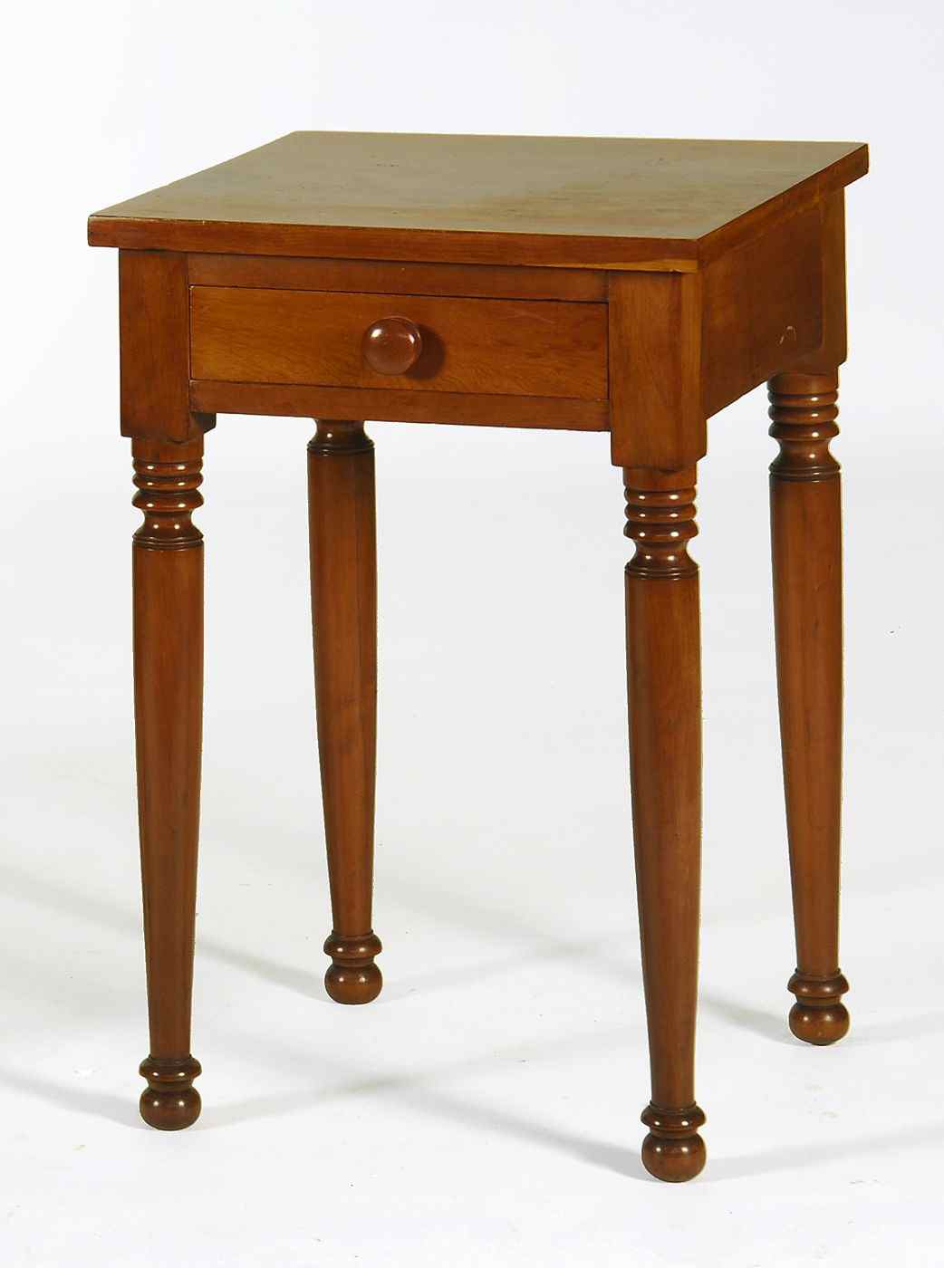 Appraisal: ANTIQUE AMERICAN SHERATON ONE-DRAWER STANDCirca In cherry with turned legs