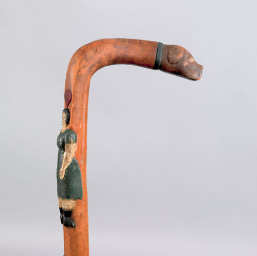 Appraisal: Pennsylvania cane with dog head handle and relief polychrome decoration