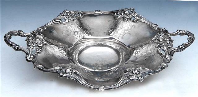 Appraisal: A VICTORIAN SILVER DISH with scroll and leaf border cast