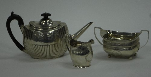 Appraisal: A matched Georgian silver three-piece tea set the teapot of