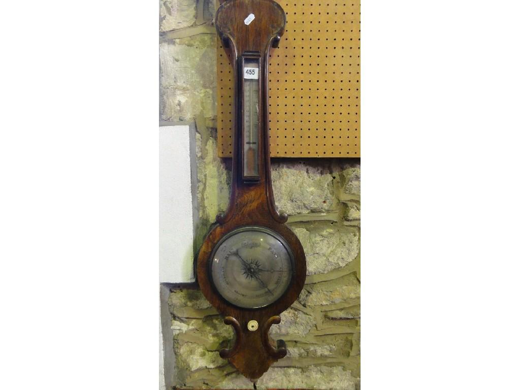 Appraisal: A th century rosewood wheel barometer with silvered dials