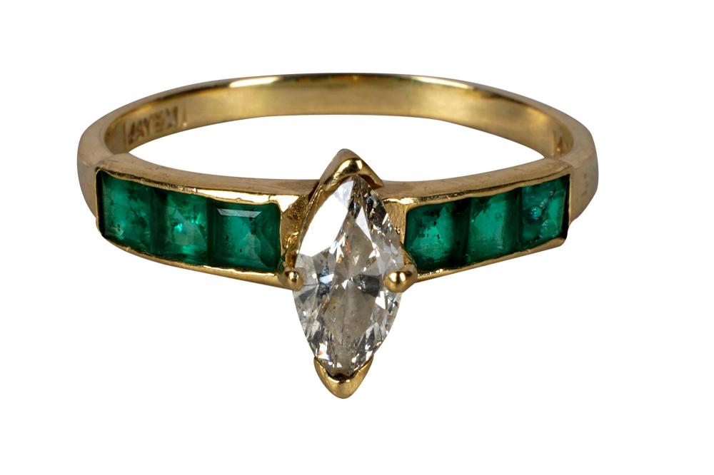 Appraisal: KARAT YELLOW GOLD DIAMOND EMERALD RINGcentering one marquise cut diamond