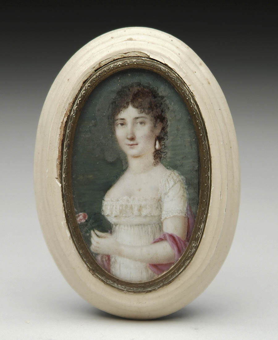 Appraisal: OVAL MINIATURE ON IVORY OF A YOUNG WOMAN WITH ROSE