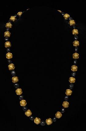 Appraisal: EARLY PERSIAN GARNET AND HOLLOW-GOLD BEAD NECKLACE in Provenance Property