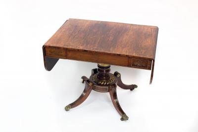 Appraisal: A Regency rosewood and brass inlaid sofa table with single