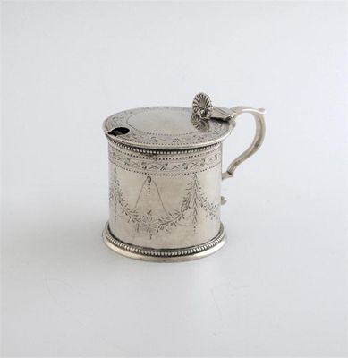 Appraisal: A Victorian drum mustard pot engraved with foliate bands and