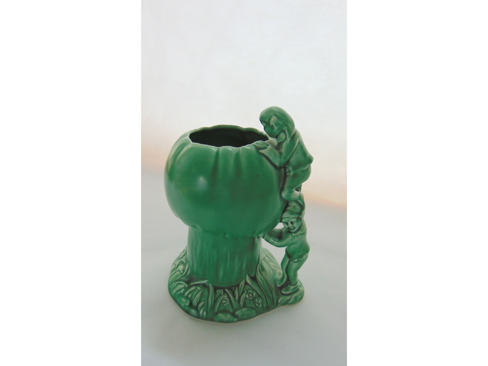 Appraisal: A Sylvac green glazed jug in the form of pixies