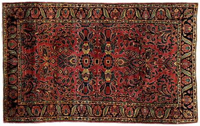 Appraisal: Sarouk rug typical floral decoration on burgundy field ft in