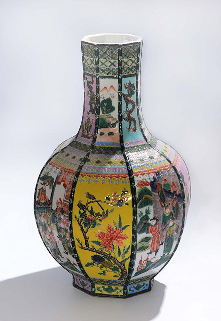 Appraisal: A CHINESE POLYCHROME PORCELAIN OCTAGONAL VASE with alternating panels of