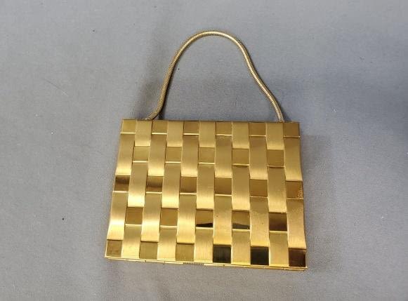 Appraisal: Vintage Ladies Compact Cigarette Case in a gold tone basket