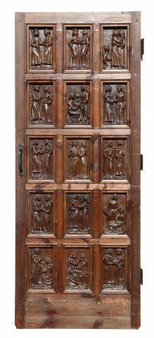 Appraisal: Architectural pine door fifteen panels carved ecclesiastic figural scenes to