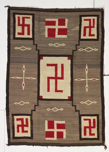 Appraisal: A Navajo rug A storm pattern variant with central whirling