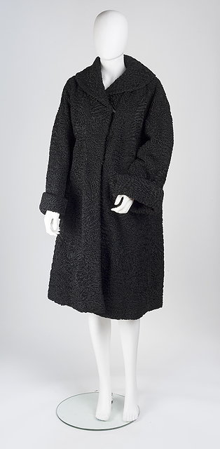 Appraisal: A black coat with full length sleeves with folded cuffs