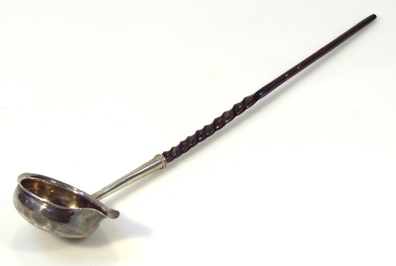 Appraisal: A George III toddy ladle with part turned whale bone