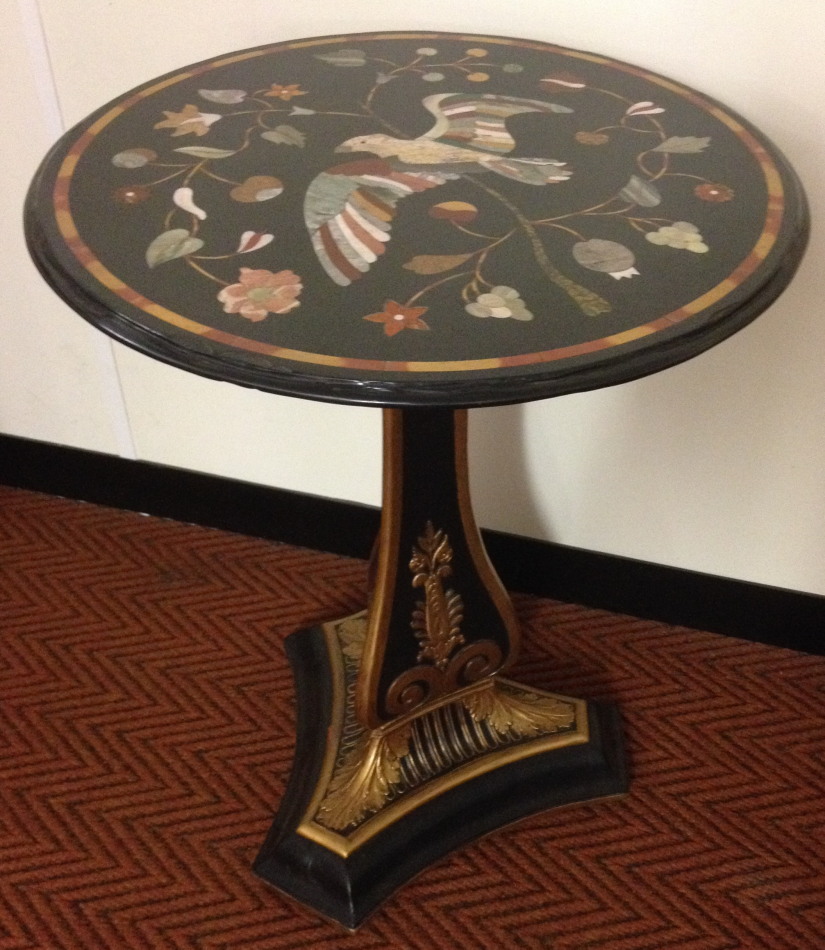 Appraisal: A parcel gilt and ebonised pedestal table with pietra dura