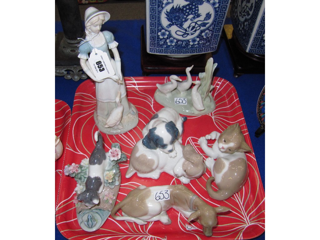 Appraisal: Two Lladro figures of cats Lladro cow Nao puppies and