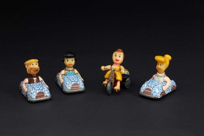 Appraisal: Lot of Tin Marx Flintstone Toys Description American Friction and