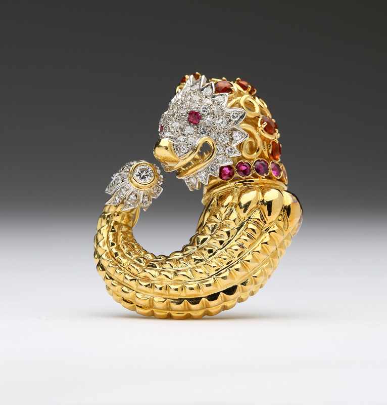 Appraisal: A large diamond gem-set and yellow gold lion's head enhancer