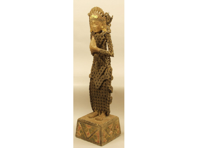 Appraisal: Late th century Indonesian Deity in carved wood and covered